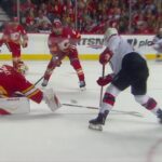 Simon Nemec scores a goal against the Calgary Flames
