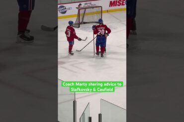 Coach Marty sharing advice to Slafkovsky & Caufield