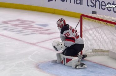Matty Beniers scores a goal against the New Jersey Devils