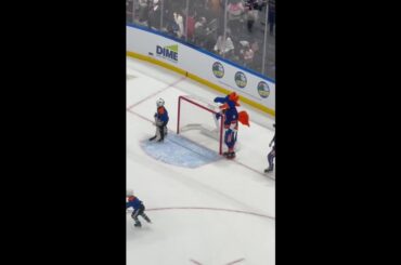 New York Islanders mascot Sparky works the glass at UBS Arena