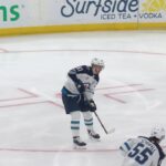 Mark Scheifele scores a goal against the New Jersey Devils