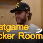 Morgan Geekie, Elias Lindholm, and David Pastrnak speak with media after overtime loss in New York