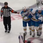 Oskar Sundqvist leaves the game with an apparent cut after colliding with Connor McDavid.