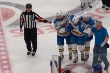 Oskar Sundqvist leaves the game with an apparent cut after colliding with Connor McDavid.