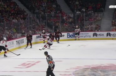 Shane Pinto scores a goal against the New Jersey Devils