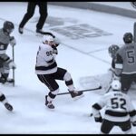 Andrei Kuzmenko Leaves the Game After Taking Puck to the Face