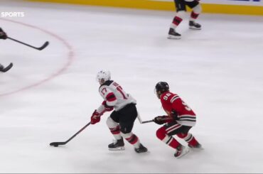 Simon Nemec scores a goal against the Chicago Blackhawks