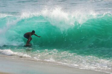 Professional Skimboarding Huge Waves On the Beach