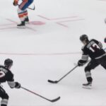 Nico Hischier scores a goal against the New York Islanders