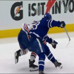 Matthew Knies sends Oiler newcomer Spencer Stastney hard into the boards 💥