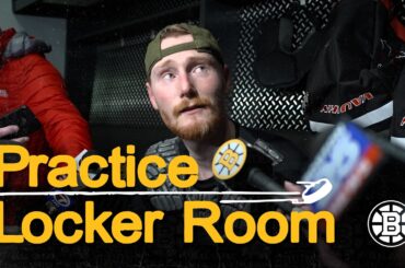 David Pastrnak, Henri Jokiharju, Joonas Korpisalo, and Morgan Geekie talk after practice on Tuesday