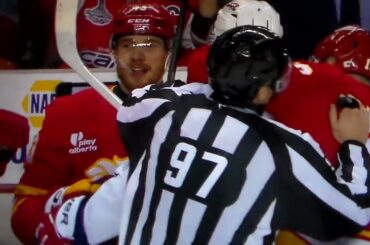 Flames' Adam Klapka takes poke at Capitals' Tom Wilson from bench, receives misconduct penalty