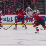 Jack Hughes scores a goal against the New York Rangers