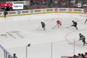 Mikael Backlund scores a goal against the New Jersey Devils