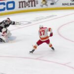 Yegor Sharangovich scores a goal against the New Jersey Devils