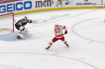 Yegor Sharangovich scores a goal against the New Jersey Devils