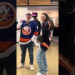 New York Islanders Admin Gives Out Pucks to Fans