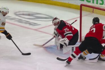 David Pastrnak scores a goal against the New Jersey Devils