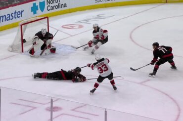 Evgenii Dadonov scores a goal against the Carolina Hurricanes
