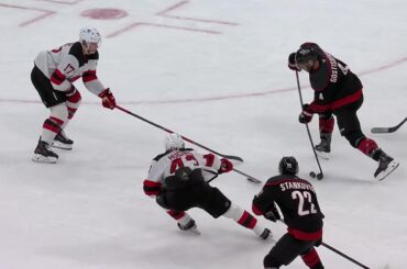 Shayne Gostisbehere scores a goal against the New Jersey Devils