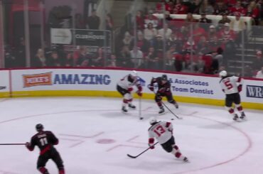 Jordan Staal scores a goal against the New Jersey Devils