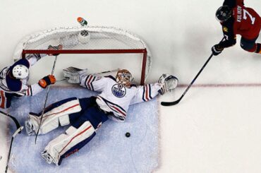 Talbot makes snow angel save on his back