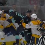 Matty Beniers DROPS GLOVE with Justin Barron