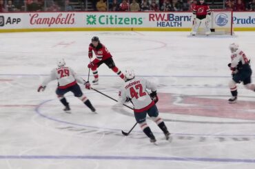 Jack Hughes scores a goal against the Washington Capitals