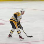 Bryan Rust scores a goal against the New Jersey Devils