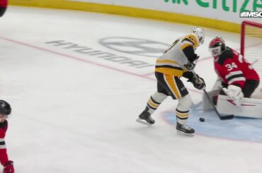 Evgeni Malkin scores a goal against the New Jersey Devils